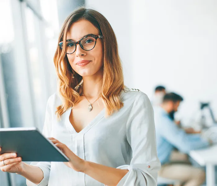 Woman in office with ipad